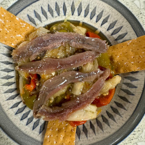 Mediterranean espencat with anchovies and grated fresh tomato
