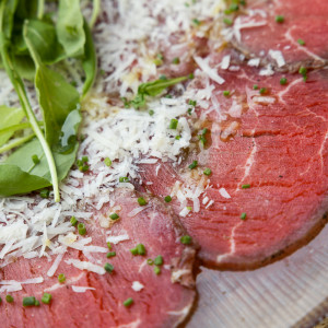 Veal carpaccio, arugula, parmesan, old mustard vinaigrette, capers and shallot